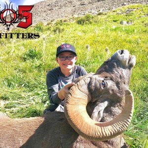 Happy Young Hunter with Trophy Ram